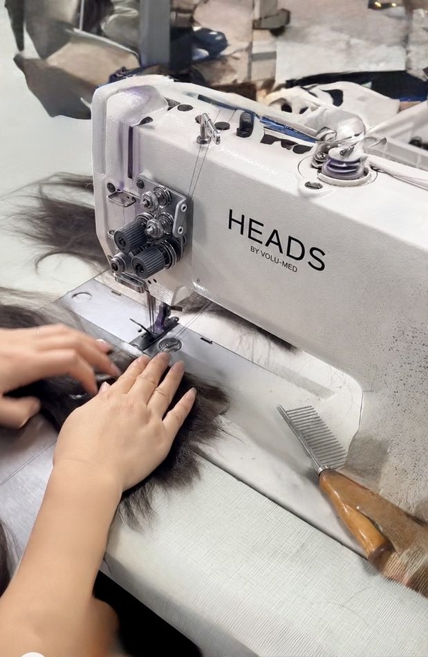 Sewing a topper on a HEADS by volu-med machine